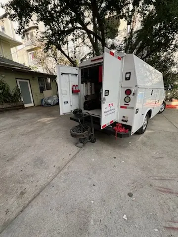 Magnet Plumbing service vehicle on-site for Grease Trap Cleaning in Scitico